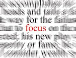 "Focus" in red in focus surrounded by blurred words