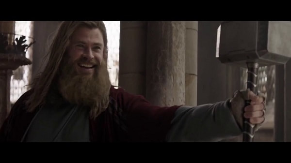 Thor holding Mjölnir triumphantly 