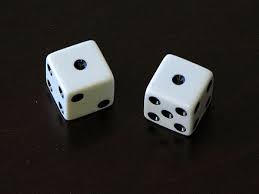 Pair of white dice both showing 1 pip