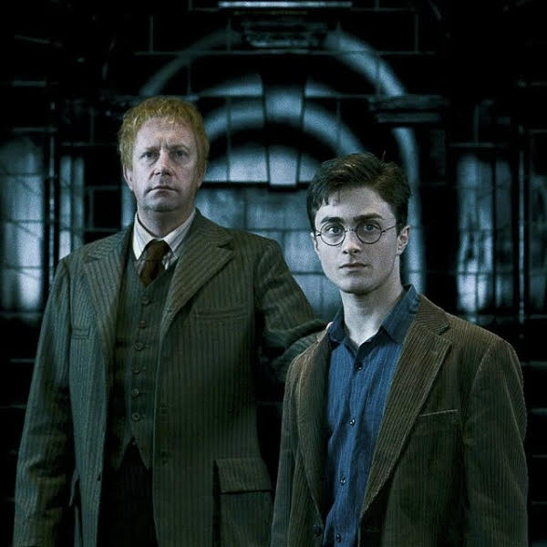 Arthur Weasley leading Harry Potter into is Ministry trial