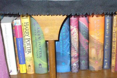 Row of Harry Potter books on a shelf