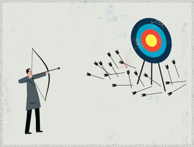 Image of man practicing archery, but no arrows have hit the target
