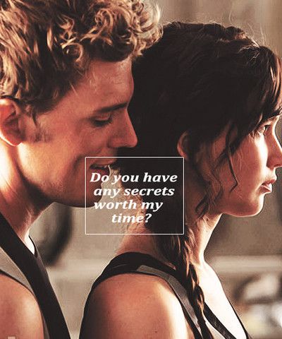 Movie still of Finnick Odair whispering behind Katniss Everdeen. Caption reads: Do you have any secrets worth my time?