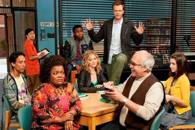 The cast of Community in their study room