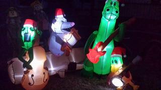Inflatable animals holding instruments